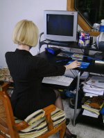 Blonde office MILF strips and spreads her ivory legs