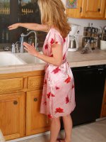 Gorgeous 54 year old getting naked in the kitchen here