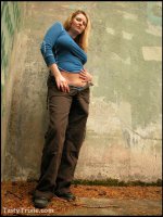 Curvy,  kinky Trixie wields her big strap-on she-cock outside.