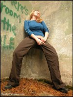 Curvy,  kinky Trixie wields her big strap-on she-cock outside.