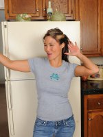 Exotic housewife Trish strps naked in front of her fridge in here