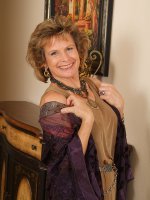 54 year old Judy strips out of her nylons and spreads her legs